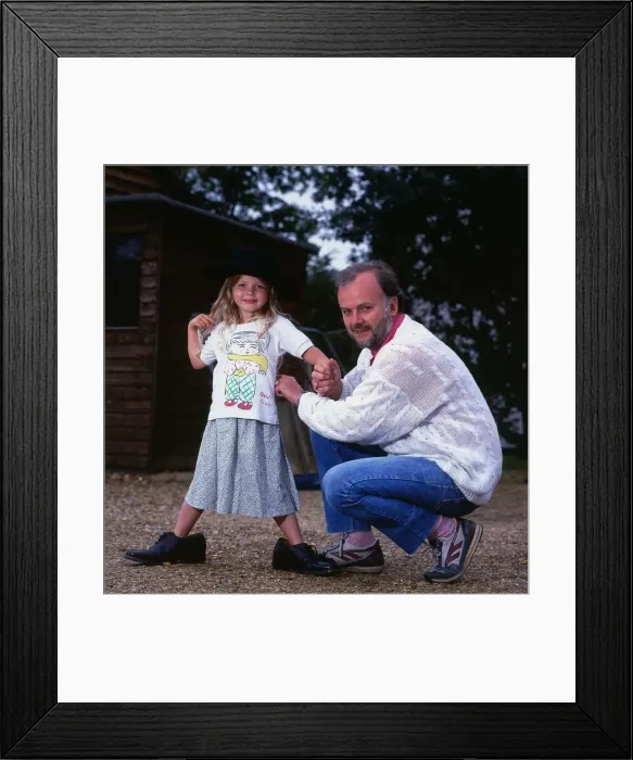 Framed Print : John Peel DJ Disc Jockey July 1987 with one of his children Florence