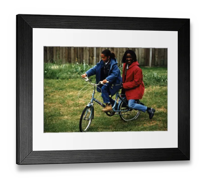 Framed Print : Diane Louise Jordan on bike with young girl her niece Justine in blue jacket Framed Print : Diane Louise Jordan on bike with young girl her niece Justine in blue jacket
