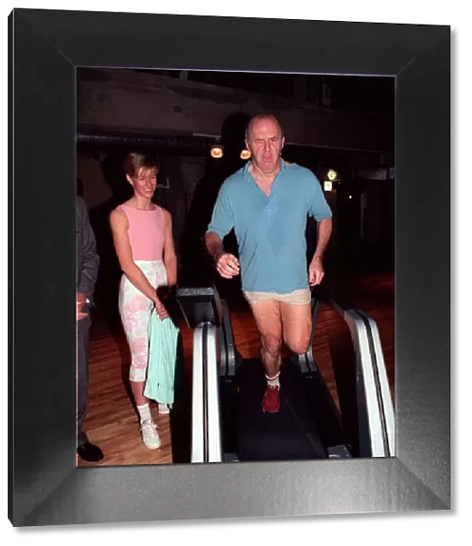 Clive James TV presenter on treadmill February 1990 On running machine