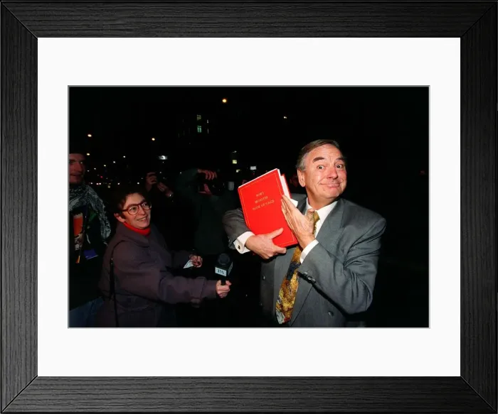 Framed Print : Bob Monkhouse Comedian  /  TV Presenter November 1996. Holding the book of gags that
