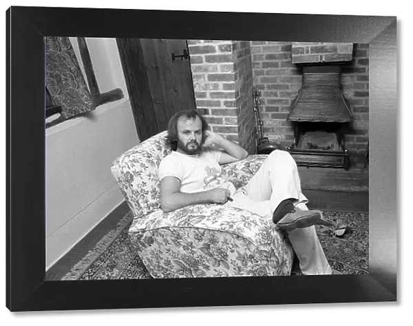 DJ John Peel at home sitting in lounge 1975 John Peel BBC Radio 1