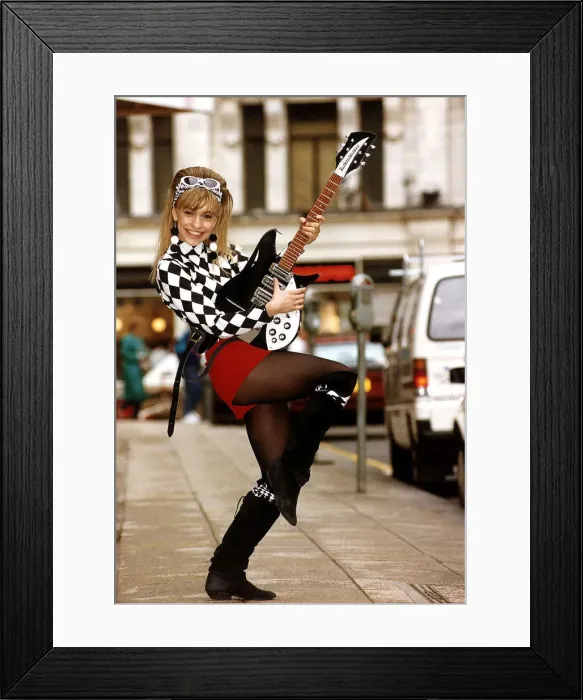 Framed Print : Michaela Strachan Childrens TV Presenter playing John Lennons Original Electric Guitar Framed Print : Michaela Strachan Childrens TV Presenter playing John Lennons Original Electric Guitar