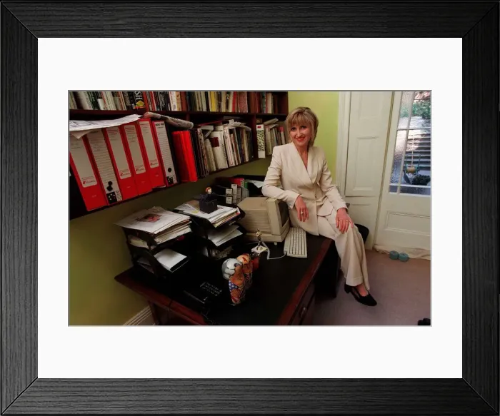 Framed Print : Jayne Irving TV Presenter July 1998 At home sitting on her desk A©mirrorpix