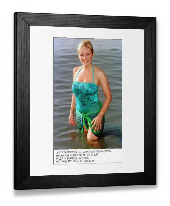 Framed Print : Amanda Reddington TV Presenter GMTV relaxing in sea near their villa in Marbella Spain Framed Print : Amanda Reddington TV Presenter GMTV relaxing in sea near their villa in Marbella Spain