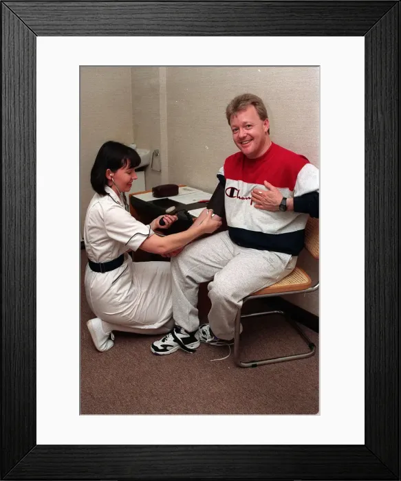 Framed Print : Keith Chegwin TV presenter at health farm January 1994 blood pressure being taken Framed Print : Keith Chegwin TV presenter at health farm January 1994 blood pressure being taken