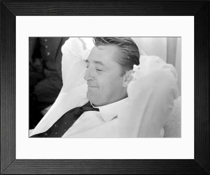 Framed Print : Actor Robert Mitchum during a press interview in London. July 1955