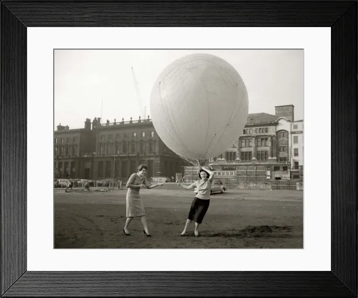 Framed Print : A Large helium filled balloon is raised over the site of the new picadilly centre to show