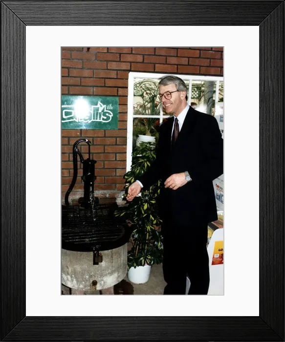 Framed Print : John Major Prime Minister throwing money into a wishing well during the 1992 election Framed Print : John Major Prime Minister throwing money into a wishing well during the 1992 election