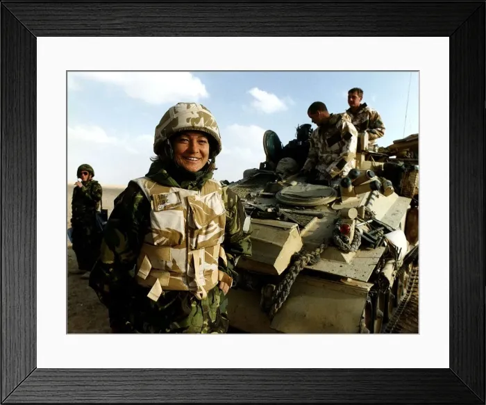Framed Print : Kate Adie the foreign correspondent for the BBC stands in fatigues alongside soldiers Framed Print : Kate Adie the foreign correspondent for the BBC stands in fatigues alongside soldiers