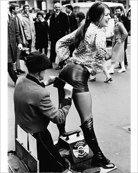 Unusual Picture of Czech model Dana Mala having her hot pants polished by a bootblack