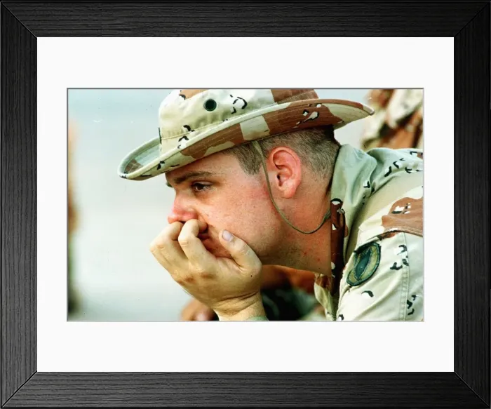 Framed Print : A nervous US soldiers contemplating what is likely to happen once the war against Iraq Framed Print : A nervous US soldiers contemplating what is likely to happen once the war against Iraq