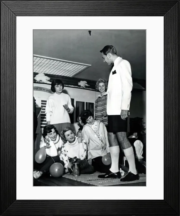 Framed Print : A man dressed in dinner jacket and shorts for dinner at the captains table on the cruise Framed Print : A man dressed in dinner jacket and shorts for dinner at the captains table on the cruise