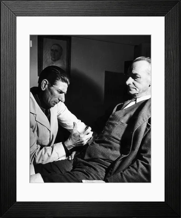 Framed Print : Dr Robert injects a hypodermic into his patient suffering from a gastric ulcer Framed Print : Dr Robert injects a hypodermic into his patient suffering from a gastric ulcer