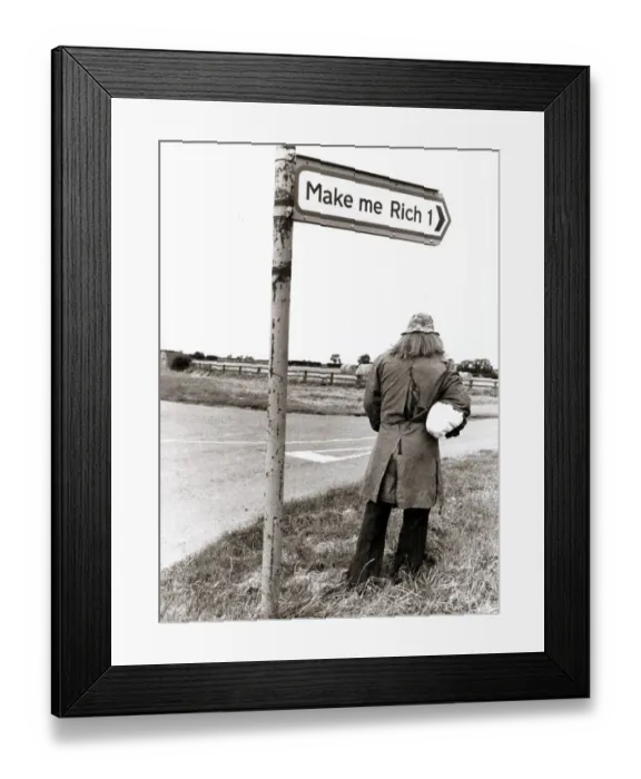 Framed Print : man stands below a road sign Make me Rich Framed Print : man stands below a road sign Make me Rich