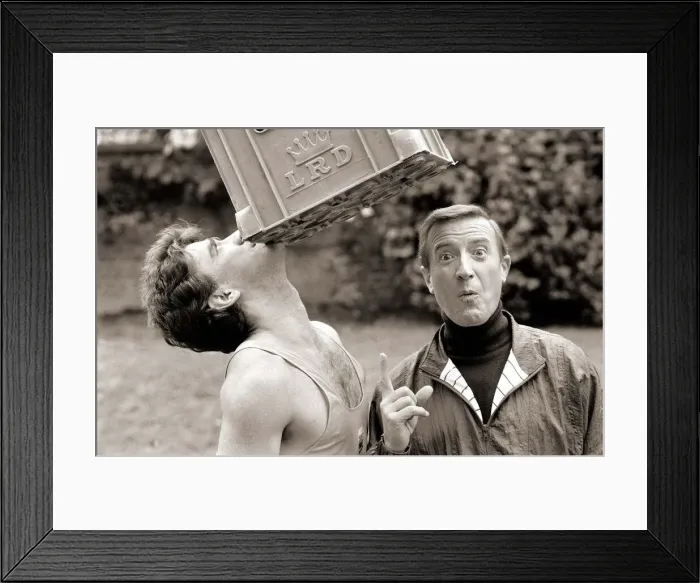 Framed Print : Terry Cole takes a crushing blow on the chin to set a New World record by balancing Framed Print : Terry Cole takes a crushing blow on the chin to set a New World record by balancing