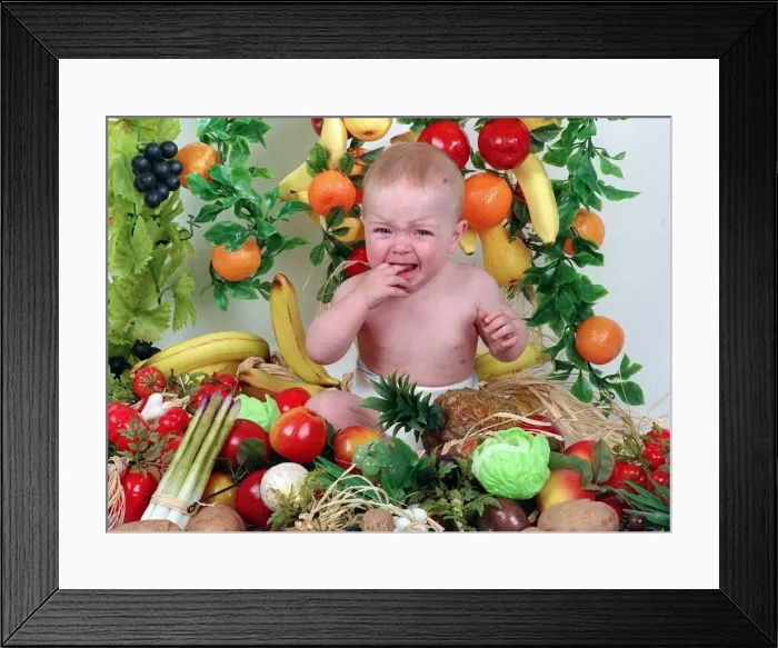 Framed Print : Sam Stewart baby wearing nappy surrounded by fruit and vegetables September 1992 fingers Framed Print : Sam Stewart baby wearing nappy surrounded by fruit and vegetables September 1992 fingers