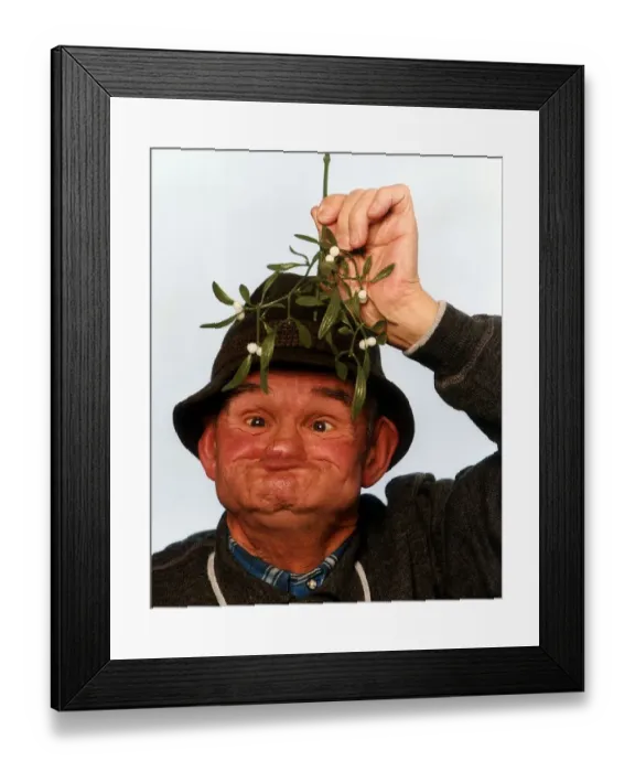 Framed Print : Gurning Man Under Mistletow December 1993 A©Mirrorpix Local Caption Framed Print : Gurning Man Under Mistletow December 1993 A©Mirrorpix Local Caption