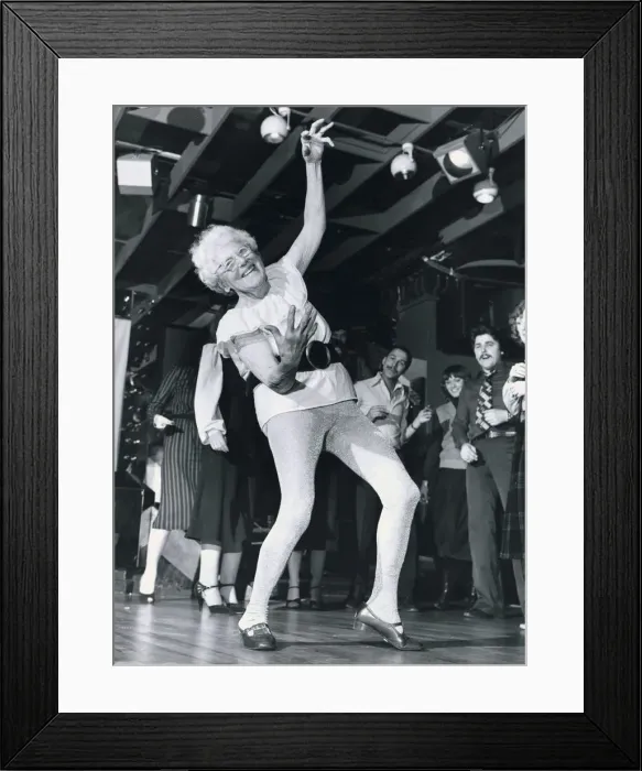 Framed Print : Disco dancing 93 year old Beattie Bradnam dances on the disco dance floor wearing a Framed Print : Disco dancing 93 year old Beattie Bradnam dances on the disco dance floor wearing a