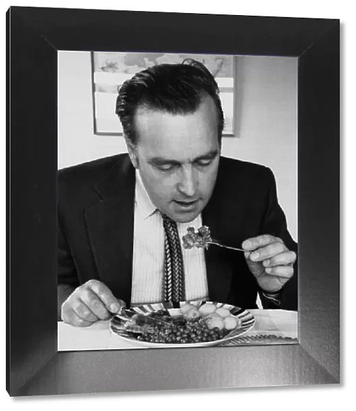 Journalist David Jack eating a meat lunch June 1975 1970s