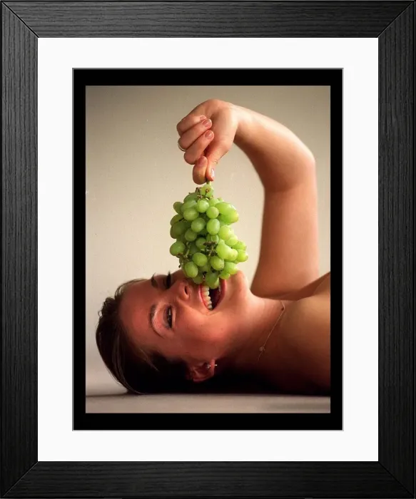 Framed Print : Model eating grapes March 1998 Framed Print : Model eating grapes March 1998