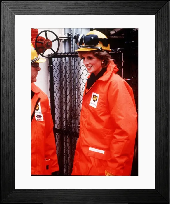 Framed Print : Princess Diana wearing a construction hard hat with protective ear guards Framed Print : Princess Diana wearing a construction hard hat with protective ear guards