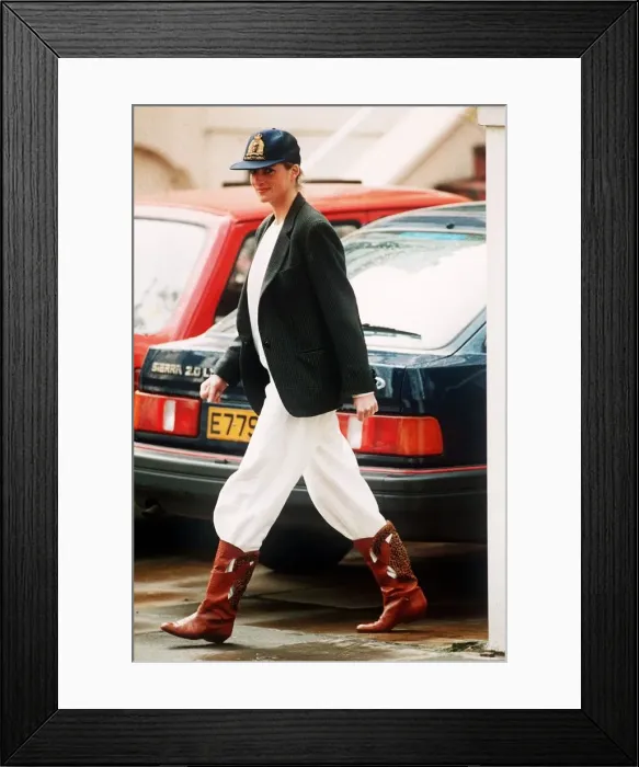 Framed Print : Princess Diana wearing an unusual combination of white trousers, boots Framed Print : Princess Diana wearing an unusual combination of white trousers, boots