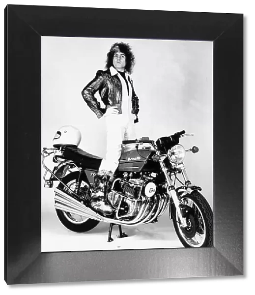 Marc Bolan Singer standing on motor-bike Dbase MSI
