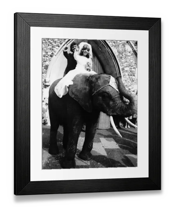 Framed Print : Arthur Dean and Penny Wheeler little people of the Circus Togni riding away from their