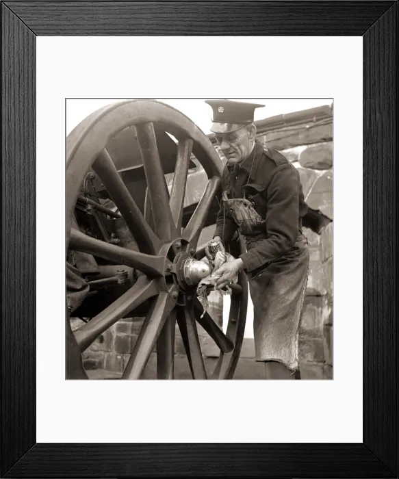 Framed Print : The Gunner getting the gun ready for firing, which is fired automatically by a nearby Framed Print : The Gunner getting the gun ready for firing, which is fired automatically by a nearby