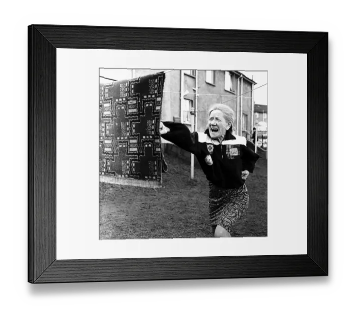 Framed Print : Annie Sweeney (A grand mother) is using a piece of carpet as she practices Karate for her Framed Print : Annie Sweeney (A grand mother) is using a piece of carpet as she practices Karate for her