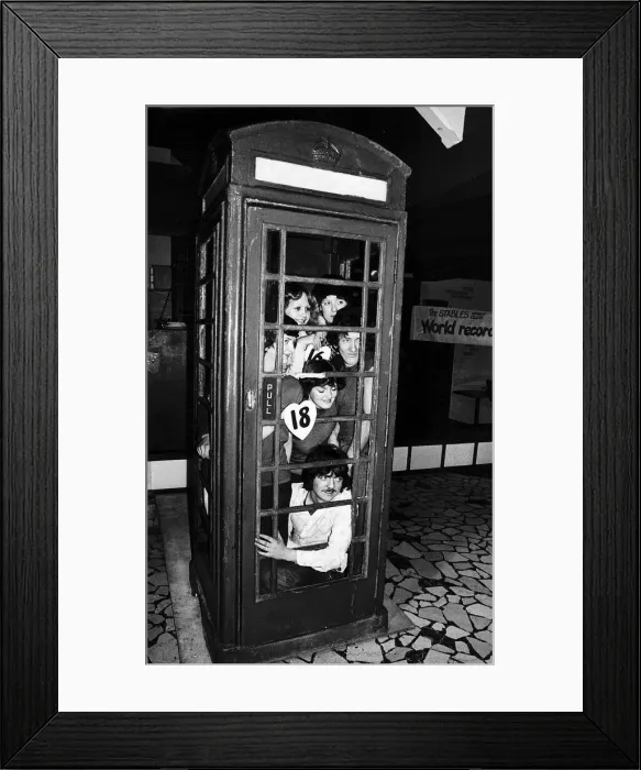 Framed Print : Twenty people set a record for squeezing into a telephone box