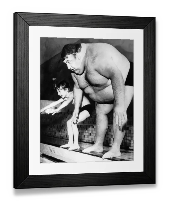 Framed Print : Unusual Pictures obese fat man tries to dive into swimming pool next to small boy
