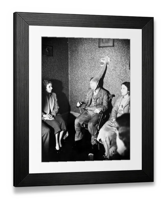 Framed Print : Taken at an ordinary seance by Leon Isaacs. Note the similarity in appearance of