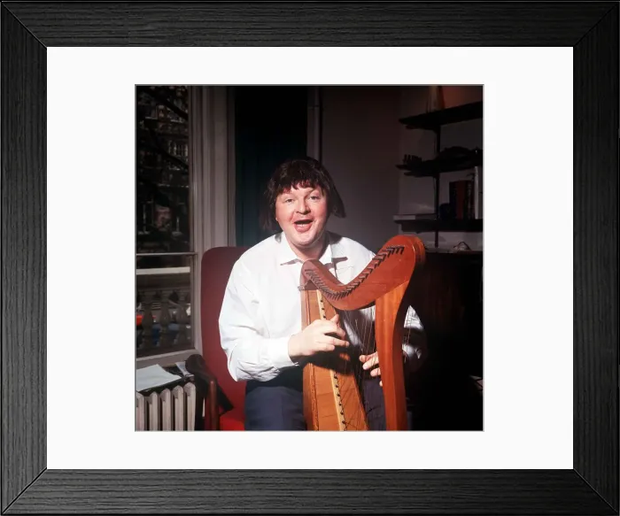 Framed Print : The comic actor Benny Hill in his Kensington flat February 1966 playing a harp Framed Print : The comic actor Benny Hill in his Kensington flat February 1966 playing a harp