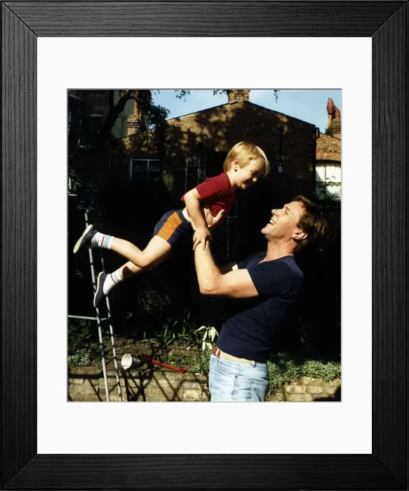 Framed Print : Timothy Bentinck Actor playing with his son Will Bentinck in his garden at home Framed Print : Timothy Bentinck Actor playing with his son Will Bentinck in his garden at home