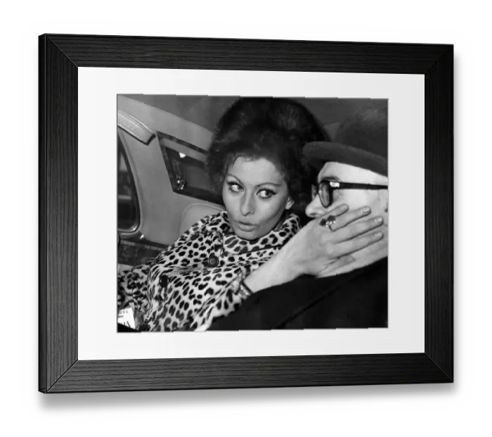 Framed Print : Carlo Ponti film producer has his cheek stroked by Sophia Loren actress Framed Print : Carlo Ponti film producer has his cheek stroked by Sophia Loren actress