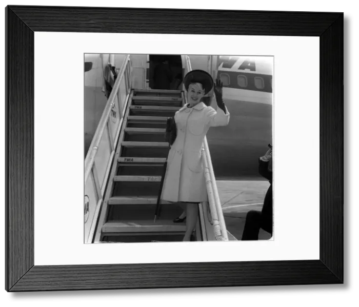 Framed Print : Dorothy Provine actress waves from aircraft steps June 1962