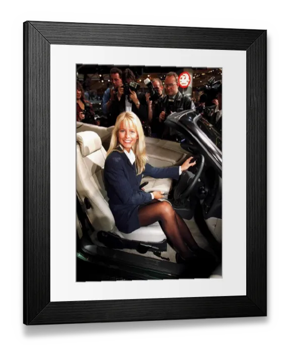 Framed Print : Ulrika Jonsson TV Presenter at the Earls Court Motor Show sitting in her new Saab car