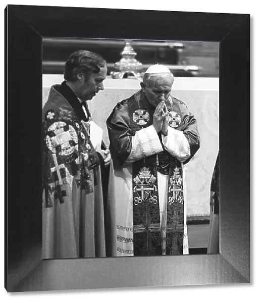 Pope John Paul II during his visit to Britain in 1982 in pray at the altar during a
