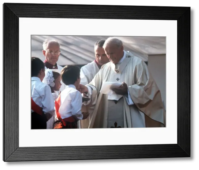 Framed Print : Pope John Paul II gives Holy Communion at Bellahouston Park in Glasgow, Scotland