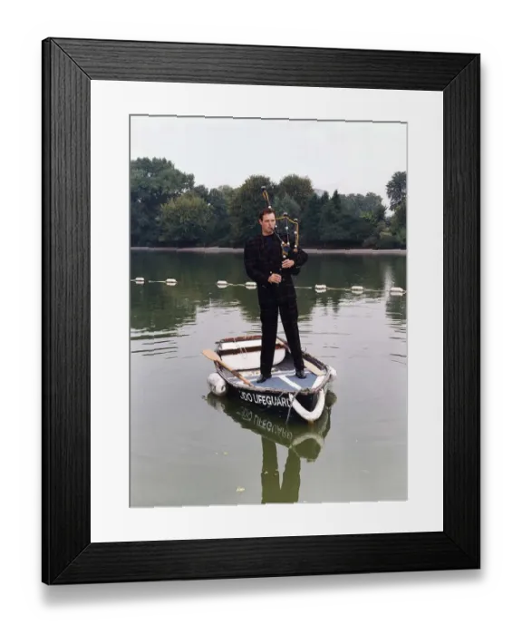 Framed Print : John Leslie TV Presenter standing in a rowing boat wearing a tartan suit Framed Print : John Leslie TV Presenter standing in a rowing boat wearing a tartan suit