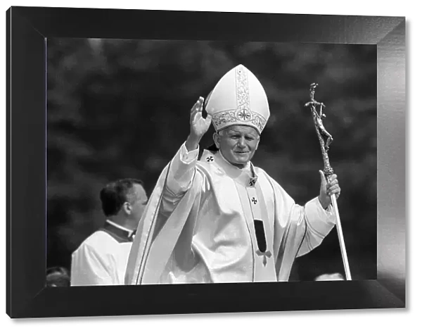 Pope John Paul II waves to the welcoming crowd at Cardiff airport, 2nd June 1982