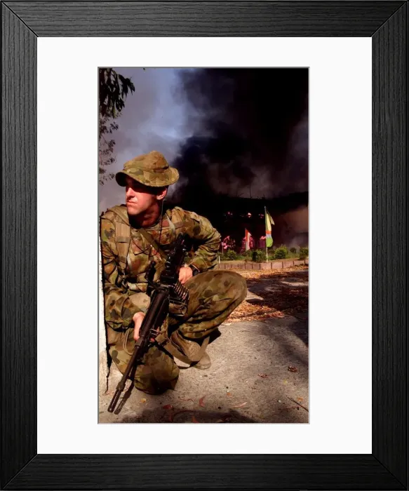 Framed Print : Indonesian Army burn their HQ as they leave Dilli Under the gaze of United Nation Framed Print : Indonesian Army burn their HQ as they leave Dilli Under the gaze of United Nation