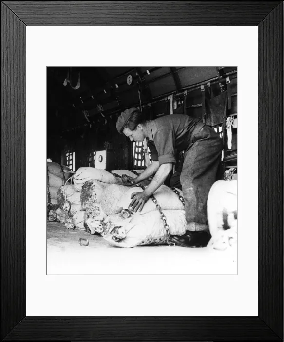 Framed Print : Berlin Air Lift 1948 A British soldier helps load goods onto a Dakota aircraft Framed Print : Berlin Air Lift 1948 A British soldier helps load goods onto a Dakota aircraft