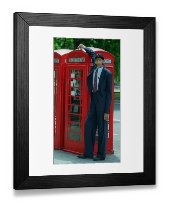 Framed Print : Naseer Ahmed Soomro claims to be World Tallest Man. In the picture he is standing next to Framed Print : Naseer Ahmed Soomro claims to be World Tallest Man. In the picture he is standing next to