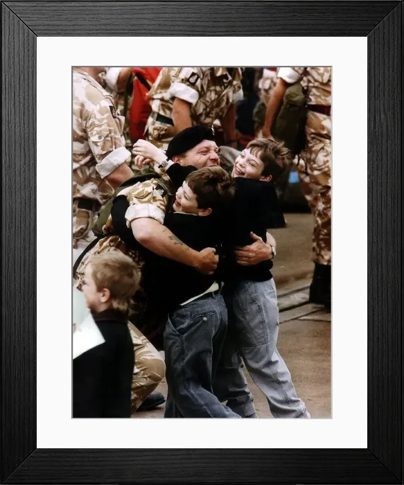 Framed Print : Gulf War reunion A soldier is met by his two children returning from Gulf War Framed Print : Gulf War reunion A soldier is met by his two children returning from Gulf War