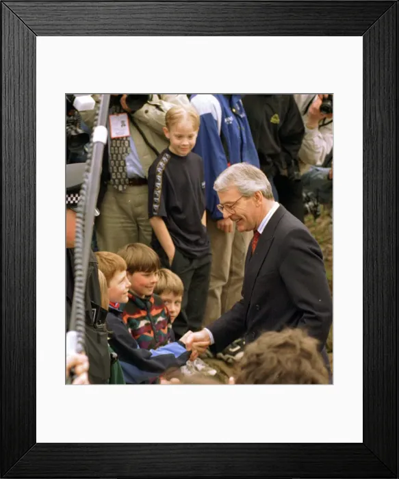 Framed Print : John Major shaking hands with small boy during his visit to Gretna Green April 1997
