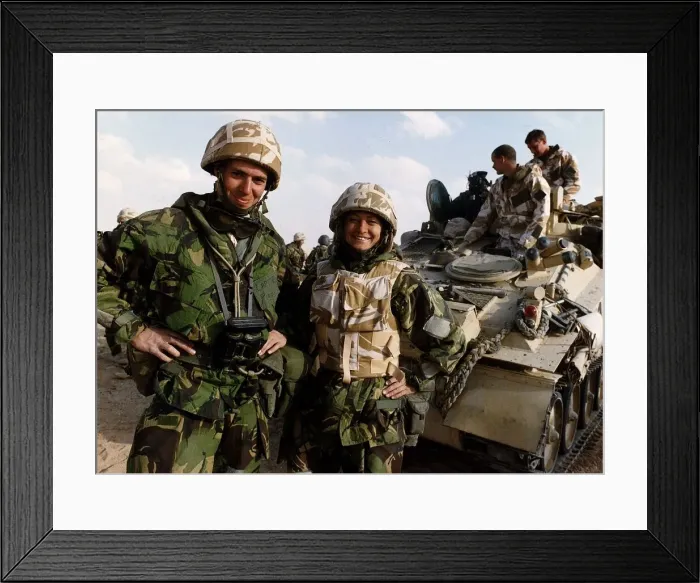 Framed Print : Kate Adie the foreign correspondent for the BBC stands in fatigues alongside soldiers Framed Print : Kate Adie the foreign correspondent for the BBC stands in fatigues alongside soldiers
