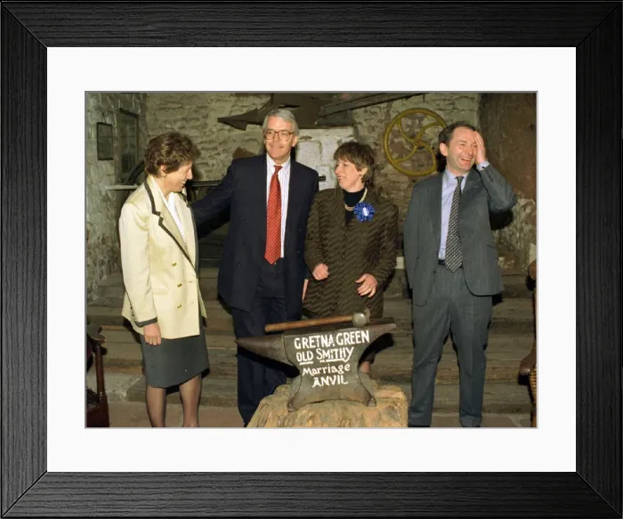 Framed Print : John and Norma Major with Michael Forsyth and wife Susan at the marriage anvil in the old