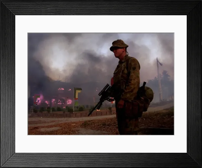 Framed Print : Indonesian Army burn their HQ as they leave Dilli Under the gaze of United Nation Framed Print : Indonesian Army burn their HQ as they leave Dilli Under the gaze of United Nation